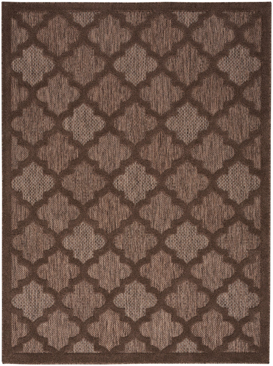 Rectangular brown rug with a repeating trellis quatrefoil pattern in light and dark browns; textured woven surface.