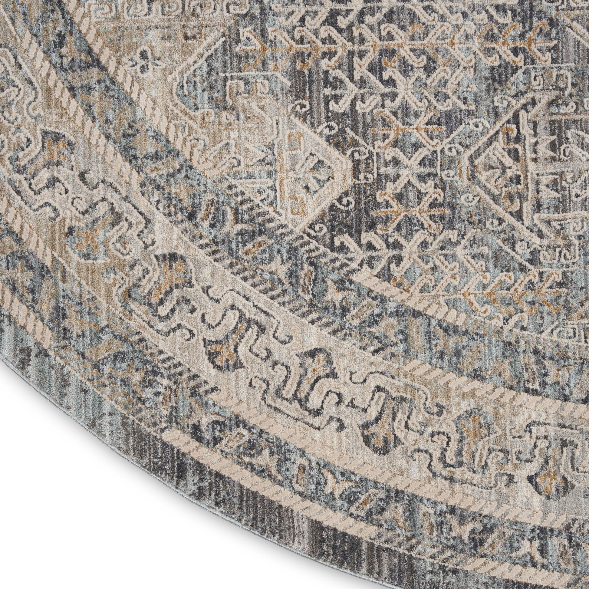 Round oriental rug in blue, ivory and beige with distressed geometric floral pattern for elegant floor decor.