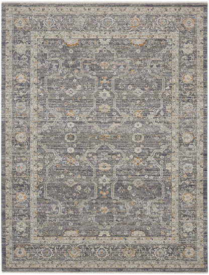 Rectangular grey-blue oriental rug with ivory border, gold accents and intricate floral medallion motif.