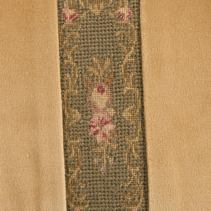 Beige rug with narrow blue-gray central panel featuring pink floral motifs and gold vines.