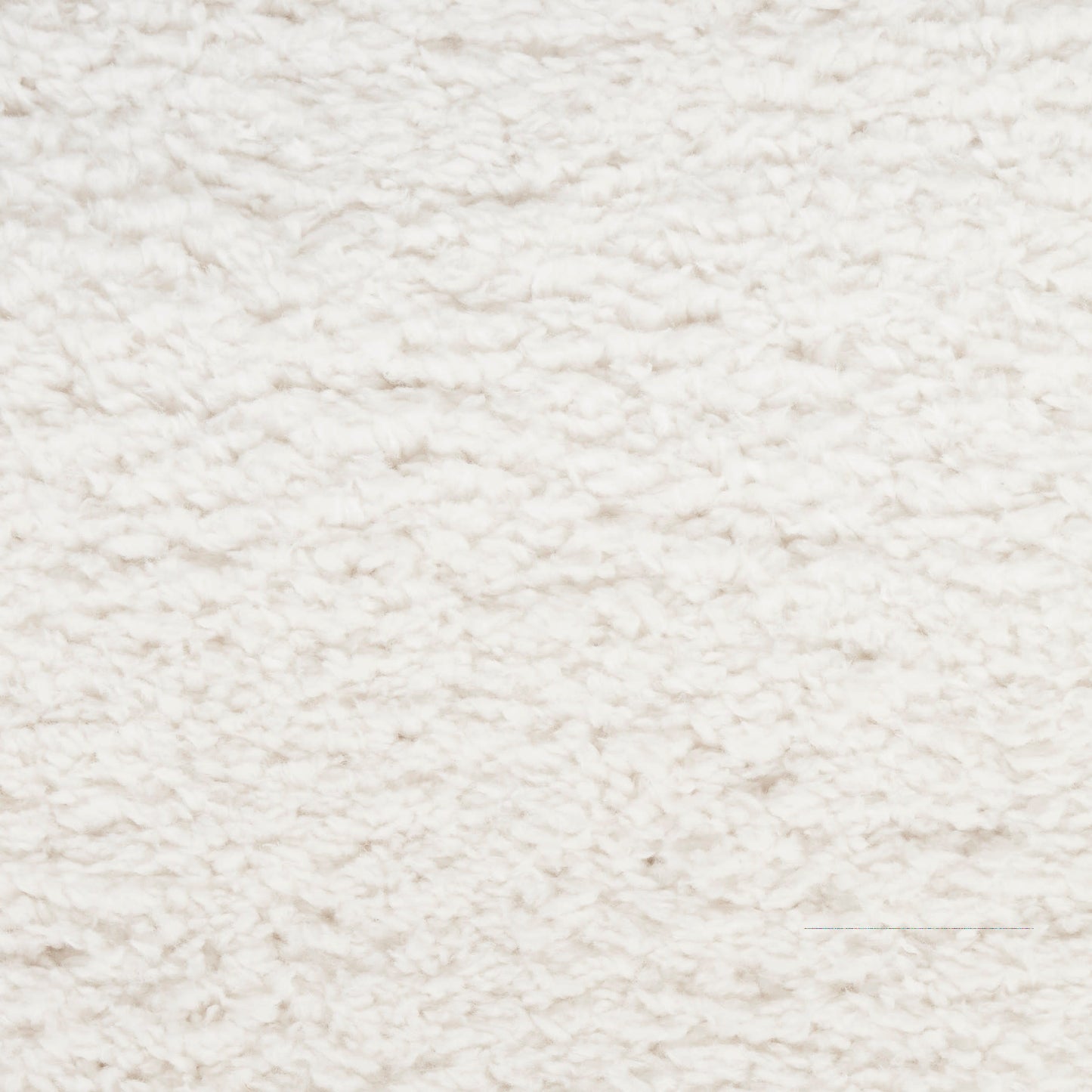 Cream shag rug close-up shows plush fluffy pile, soft textured surface for cozy living room decor.