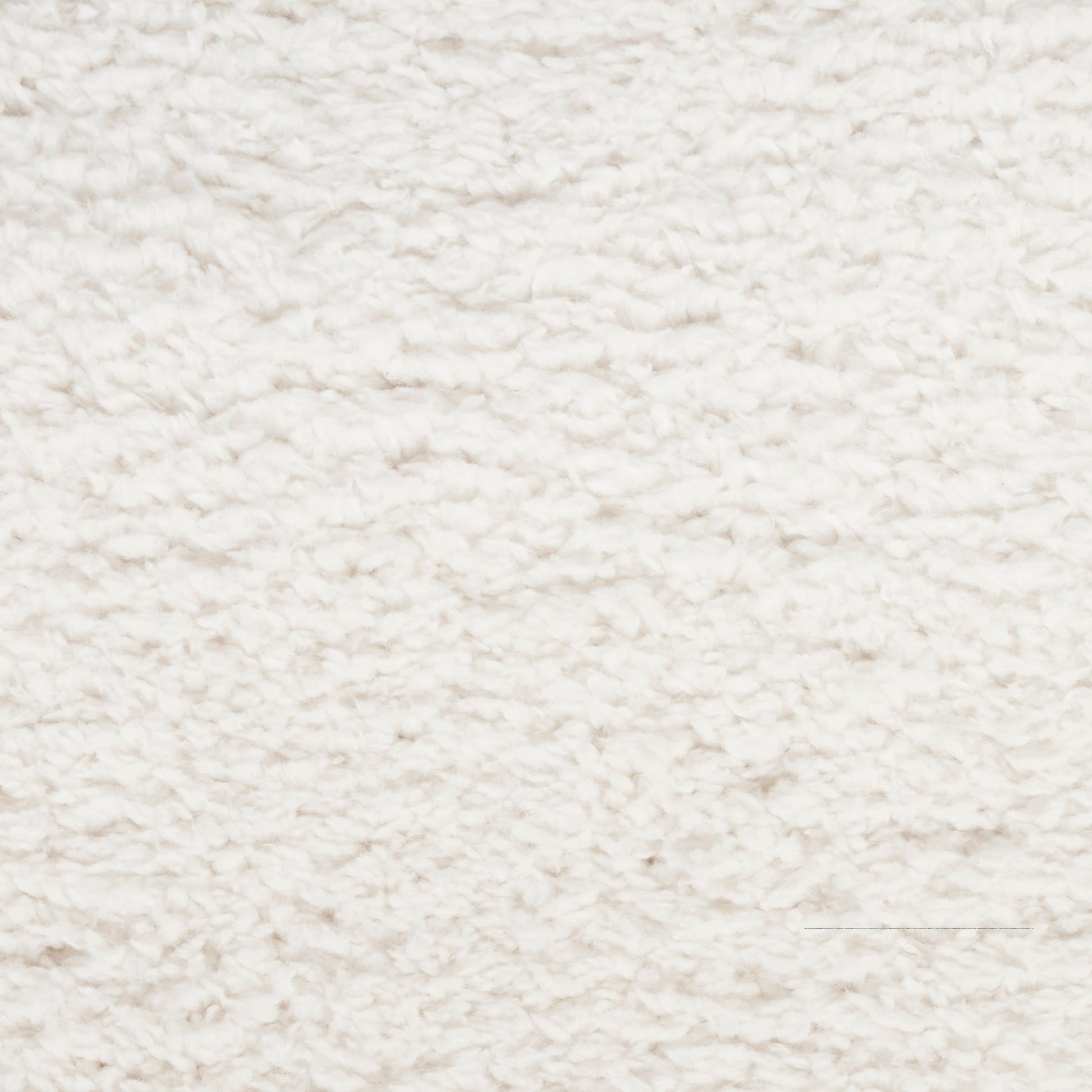 Cream shag rug close-up shows plush fluffy pile, soft textured surface for cozy living room decor.