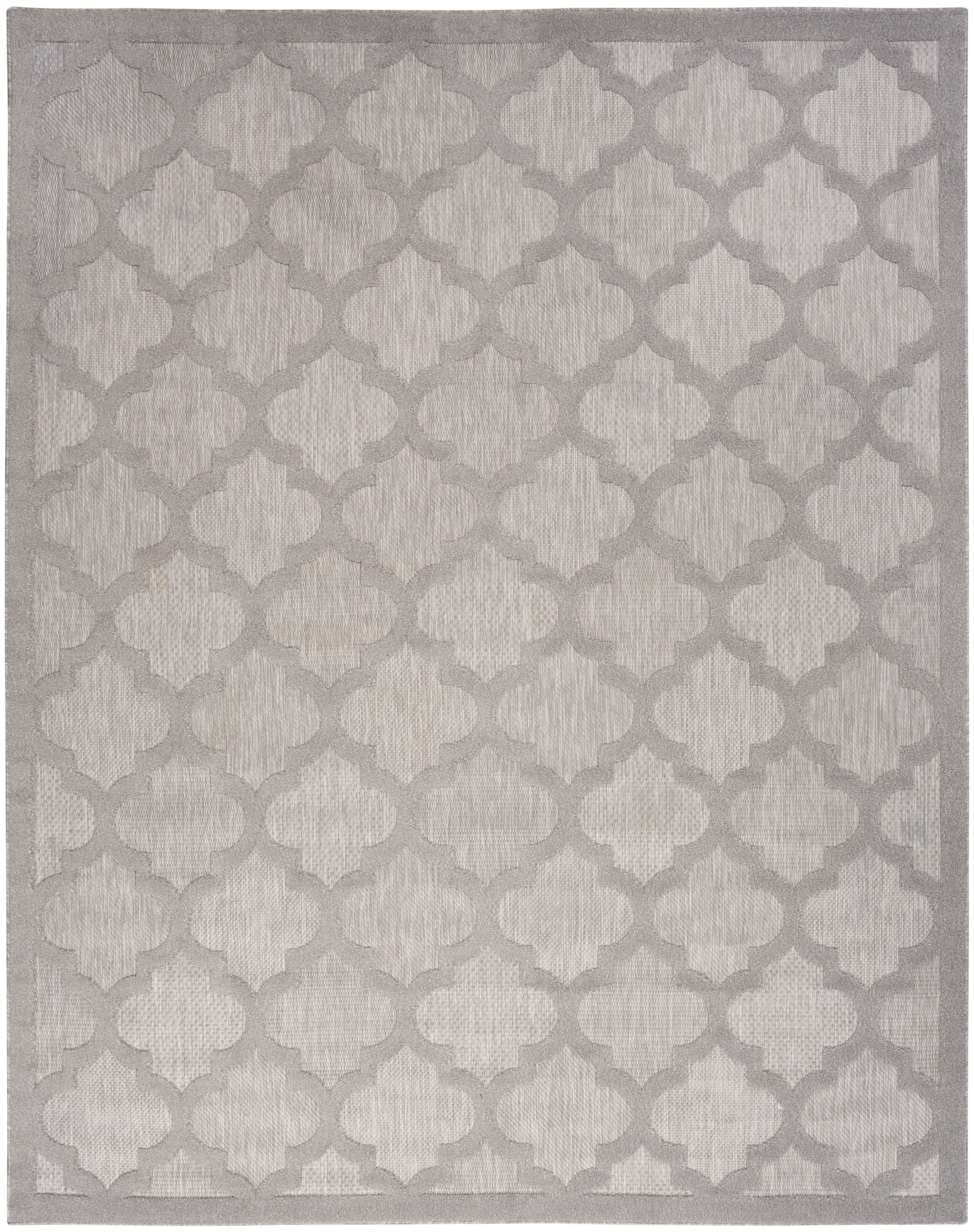 Soft neutral area rug with ivory background and taupe-gray quatrefoil trellis pattern; textured pile with subtle border.