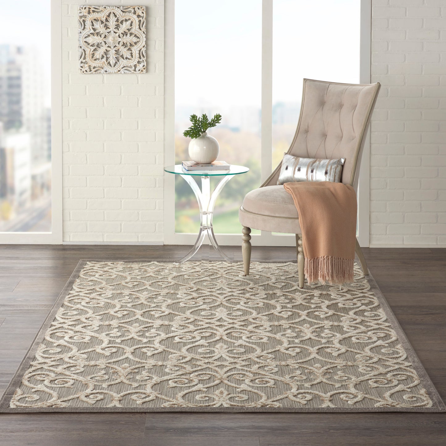 Beige patterned 5' x 8' area rug in a bright city loft.