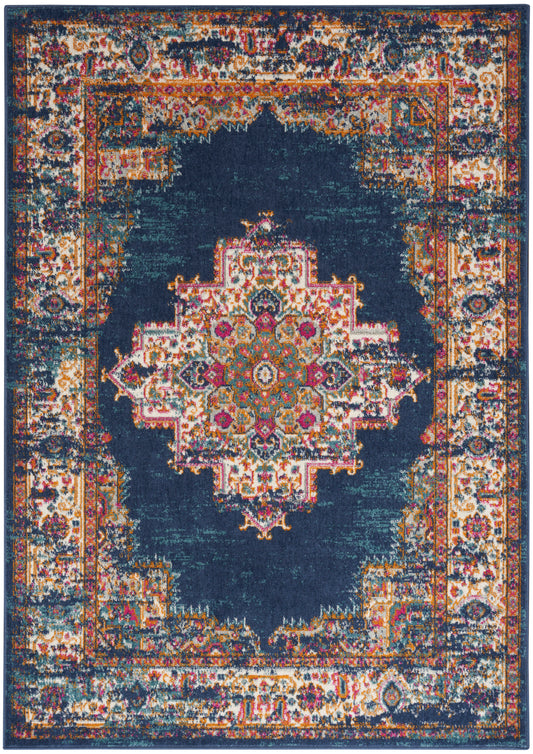 Rectangular oriental rug with a deep navy center, vibrant multicolor medallion, and antiqued ivory/gold border.