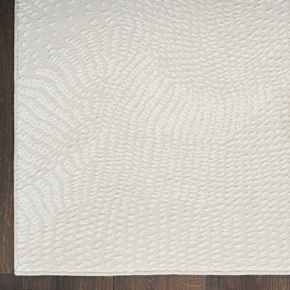 Ivory textured area rug with raised swirl pattern and plush loop pile, modern cozy living room decor.