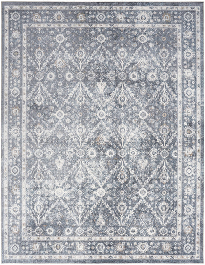 Rectangular blue-gray vintage-style oriental rug with distressed floral lattice and bordered edges; ideal living room decor.