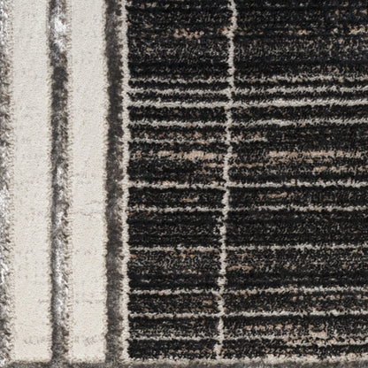 Close-up of a textured rug with beige and black stripes; plush pile, modern geometric pattern.