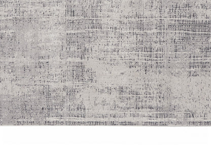 Neutral grey distressed area rug with subtle charcoal grid; modern, soft pile for living room or bedroom.