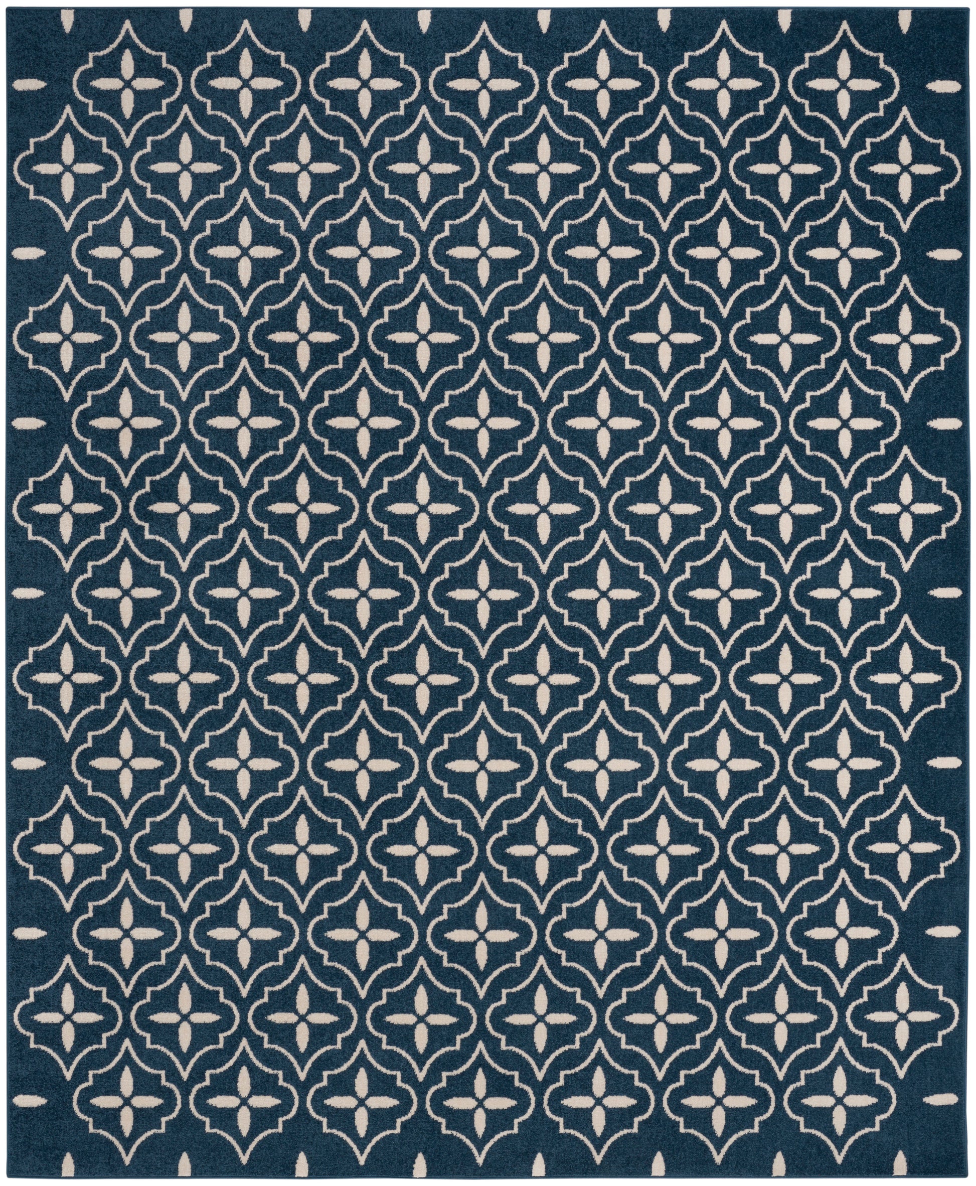 Navy blue area rug with a white repeating trellis/quatrefoil pattern for a modern geometric look.