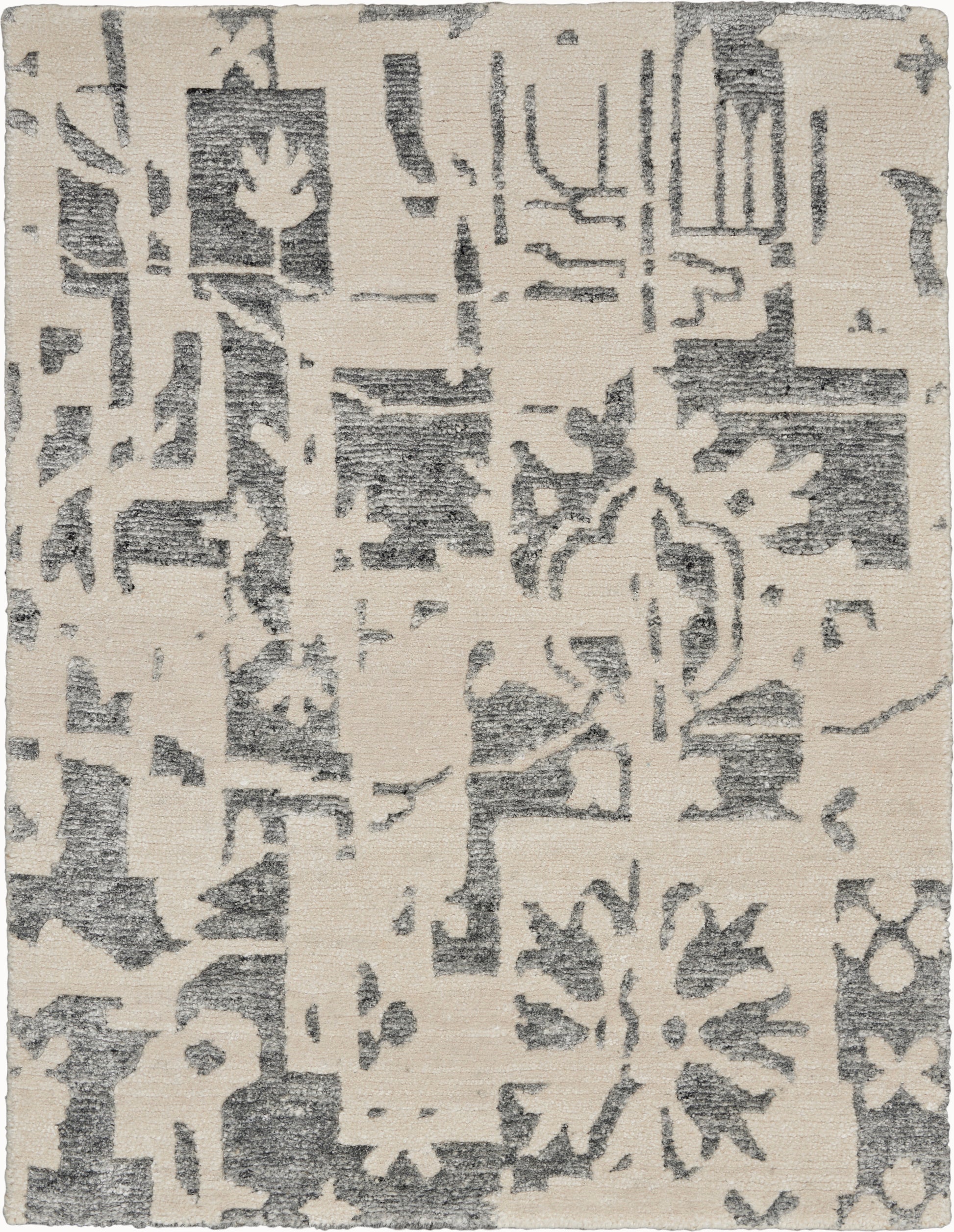 Rectangular cream rug with gray distressed abstract floral and geometric pattern; modern decorative style.