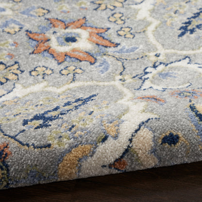 Soft plush rug in light grey with blue, ivory & peach floral pattern; tufted, medium pile for living room decor