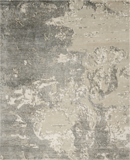 Rectangular abstract rug in gray and beige with distressed pattern; soft plush texture for living room decor.