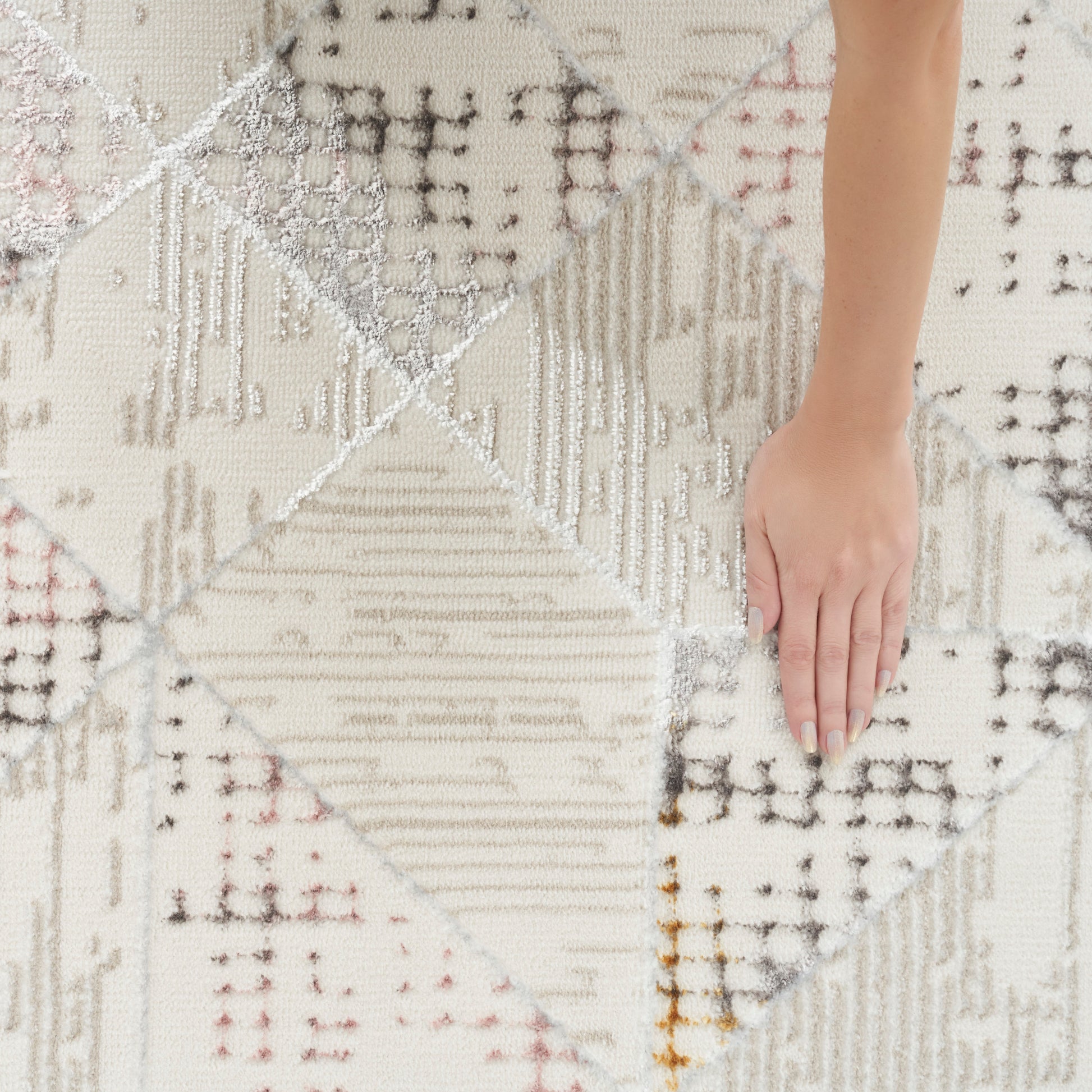 Neutral patchwork rug with cream, beige, gray diamonds; woven kilim texture.