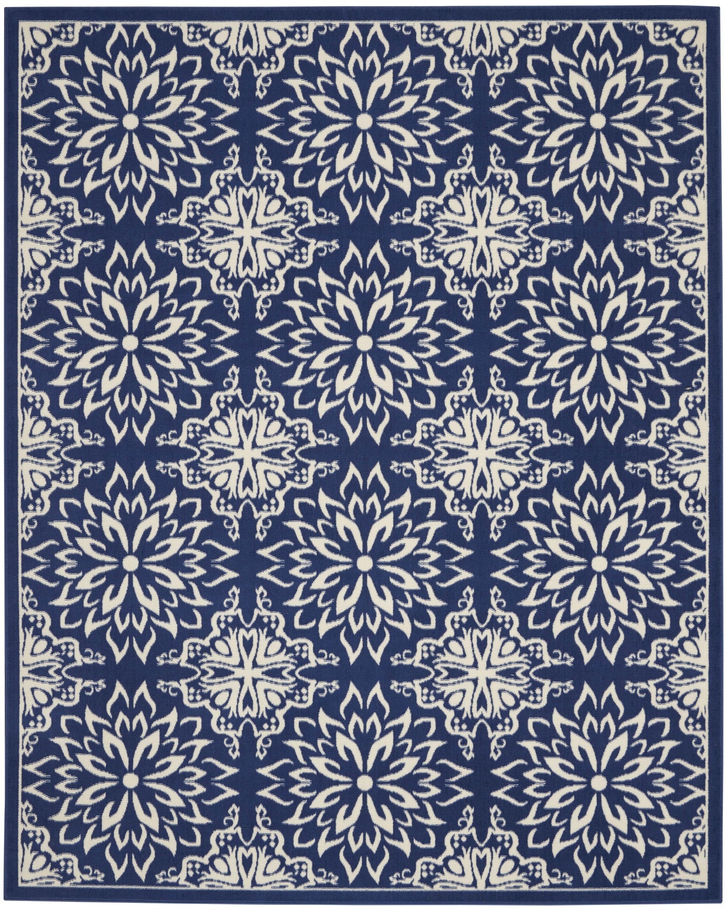 Navy blue rug with ivory ornate floral medallion motifs in a repeating pattern and a decorative border.