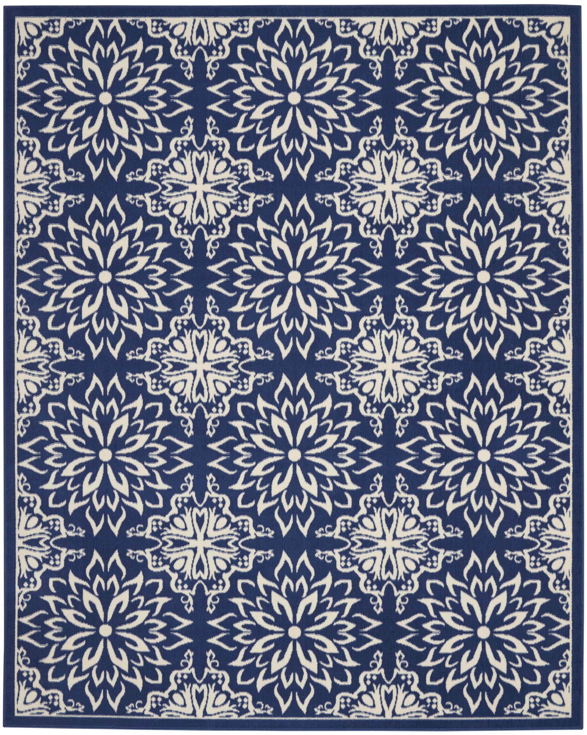 Navy blue rug with ivory ornate floral medallion motifs in a repeating pattern and a decorative border.