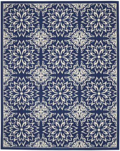 Navy blue rug with ivory ornate floral medallion motifs in a repeating pattern and a decorative border.