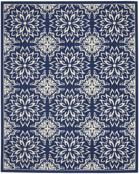 Navy blue rug with ivory ornate floral medallion motifs in a repeating pattern and a decorative border.