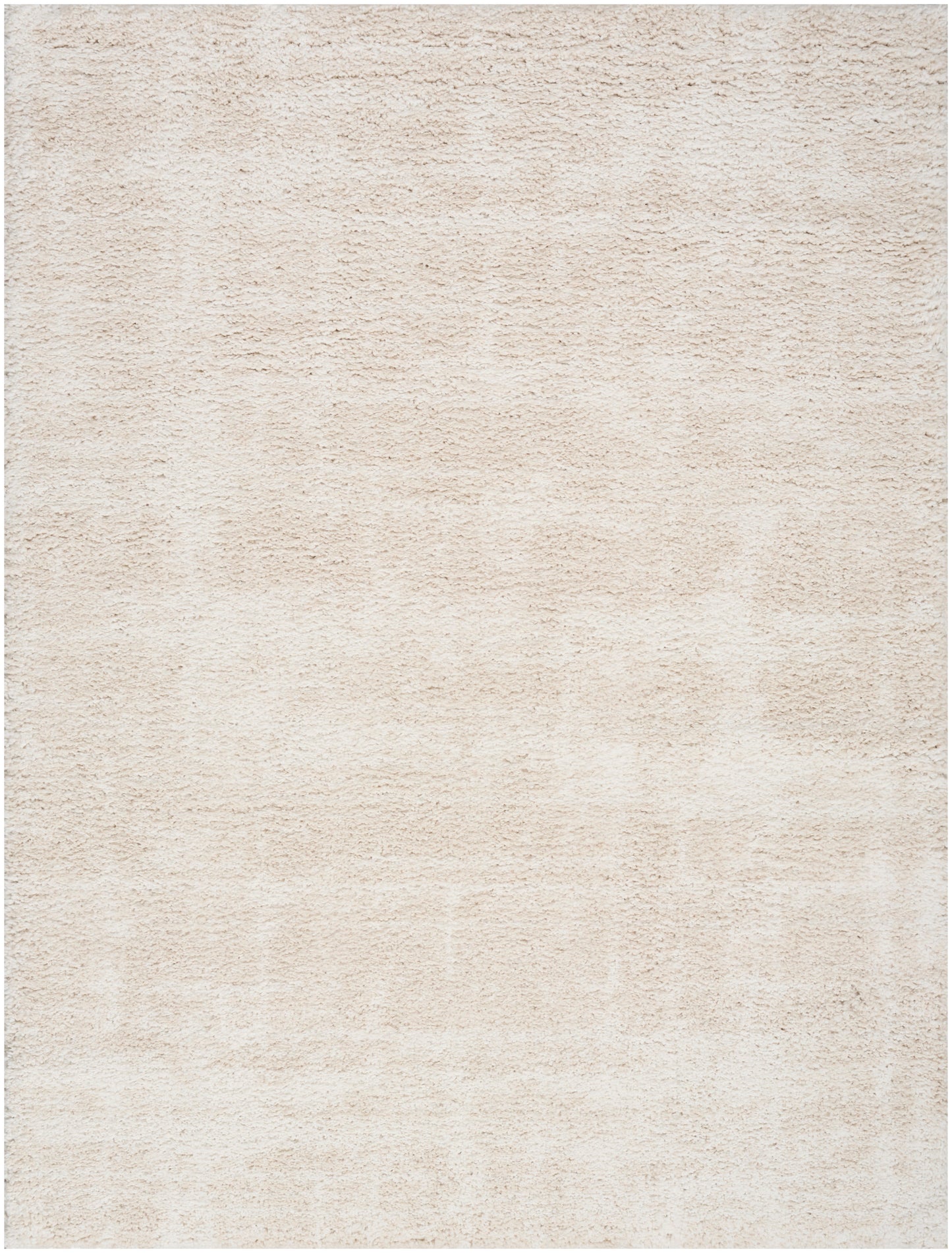 Beige textured area rug with soft plush pile; neutral rectangular floor covering.