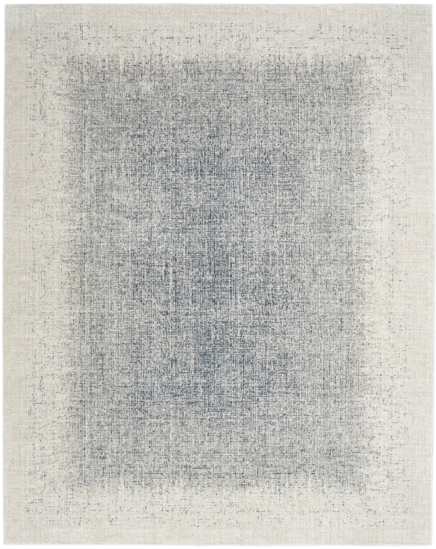 Rectangular cream rug with a distressed blue-gray center wash; woven texture, modern minimalist style for living rooms.