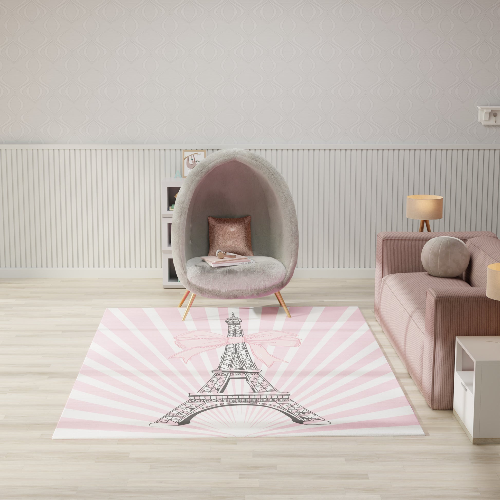 Pastel pink rug with black Eiffel Tower sketch, in a modern living room with a soft grey fuzzy egg chair and blush sofa.