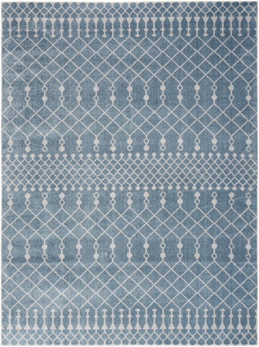 Blue rectangular area rug with white lattice and dotted stripe motifs, modern boho style.