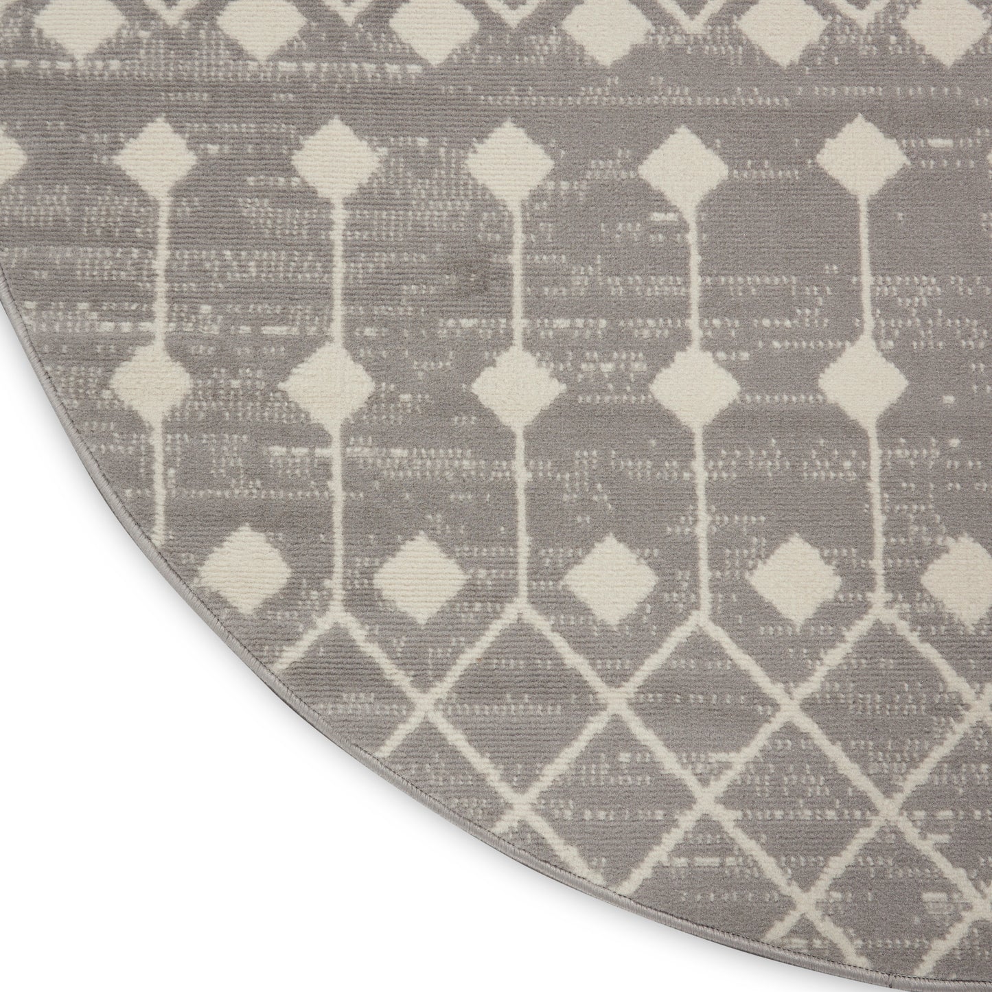 Round rug in grey & ivory geometric trellis pattern; woven texture, soft neutral colorway.
