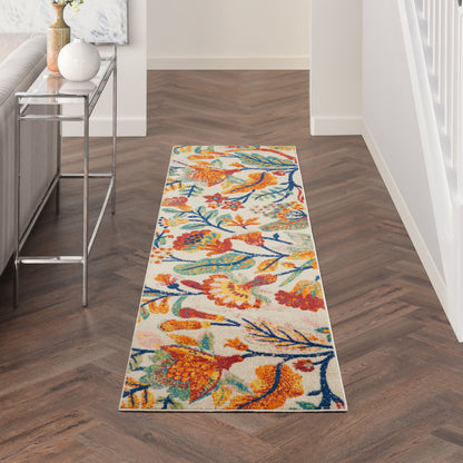 Colorful hallway runner with orange, blue & yellow floral birds on light background; wood chevron floor.