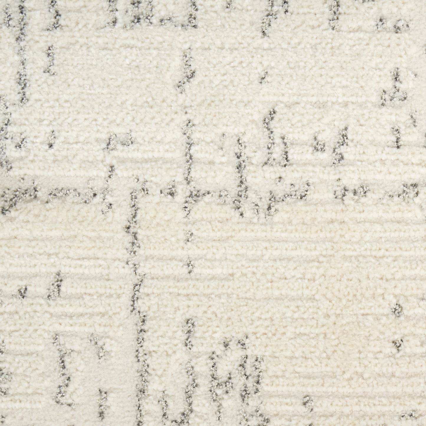 Cream rug with plush pile and subtle light-gray linear geometric pattern; modern, cozy decor.