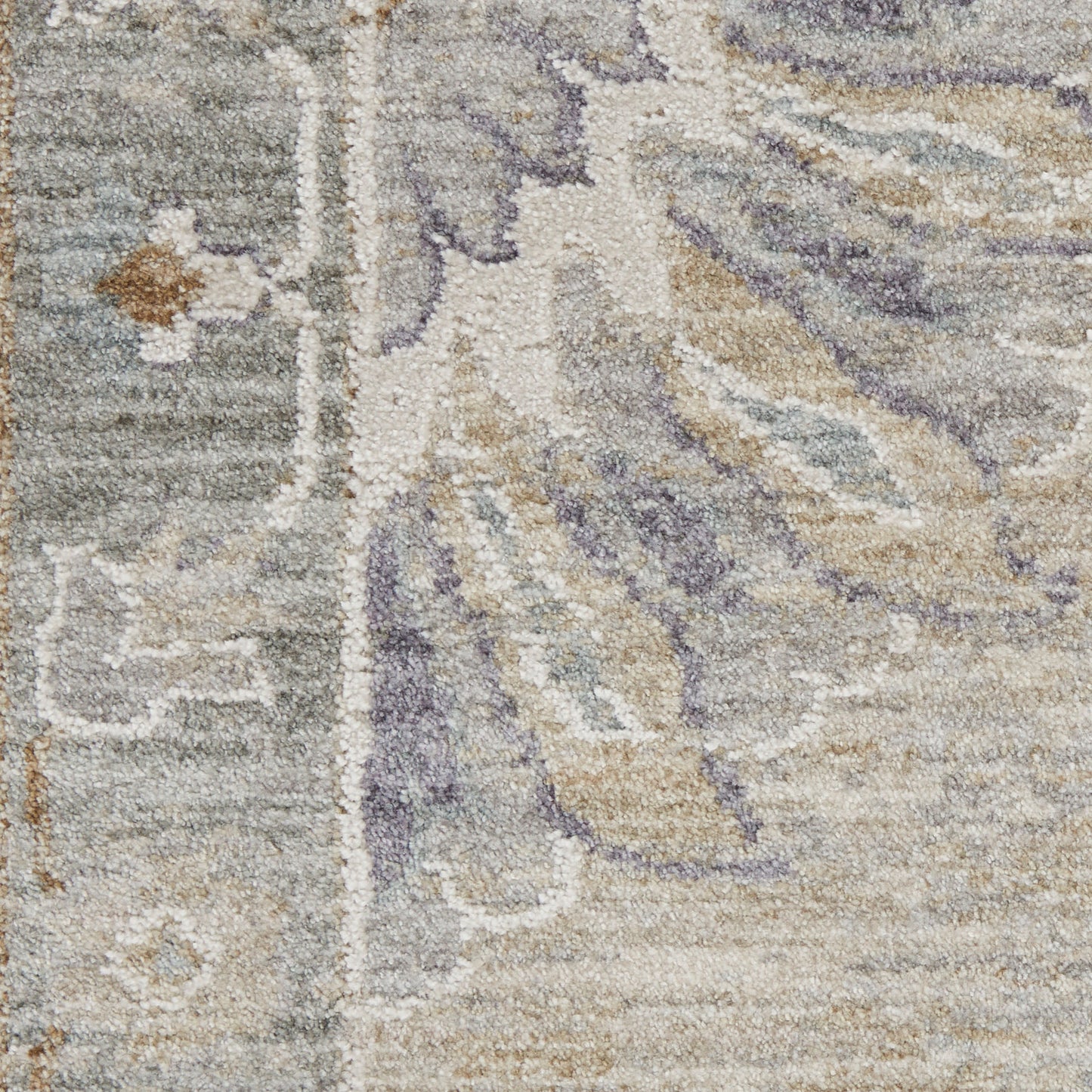 Ornate patterned area rug in cream, beige, gray and lavender with plush pile.