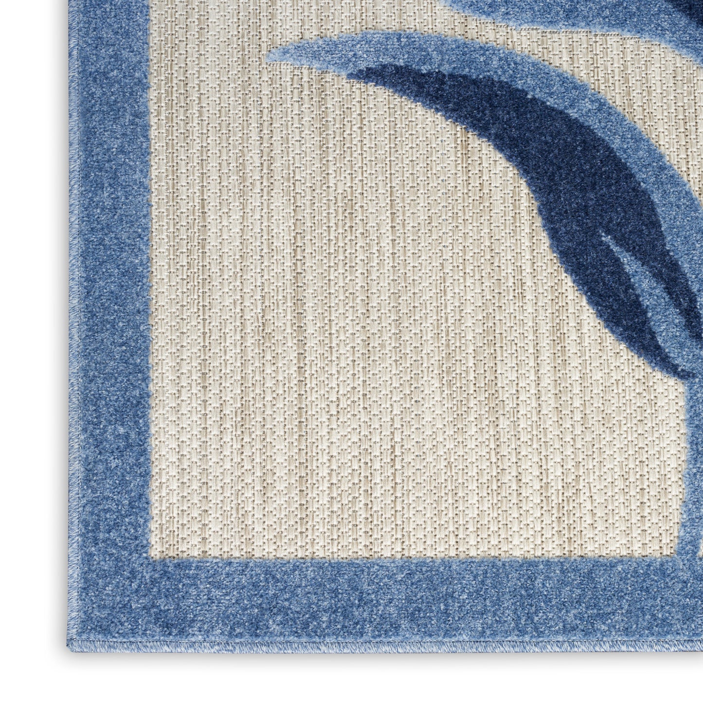 Beige woven rug with a blue border and blue abstract curved shapes, textured looped pile.