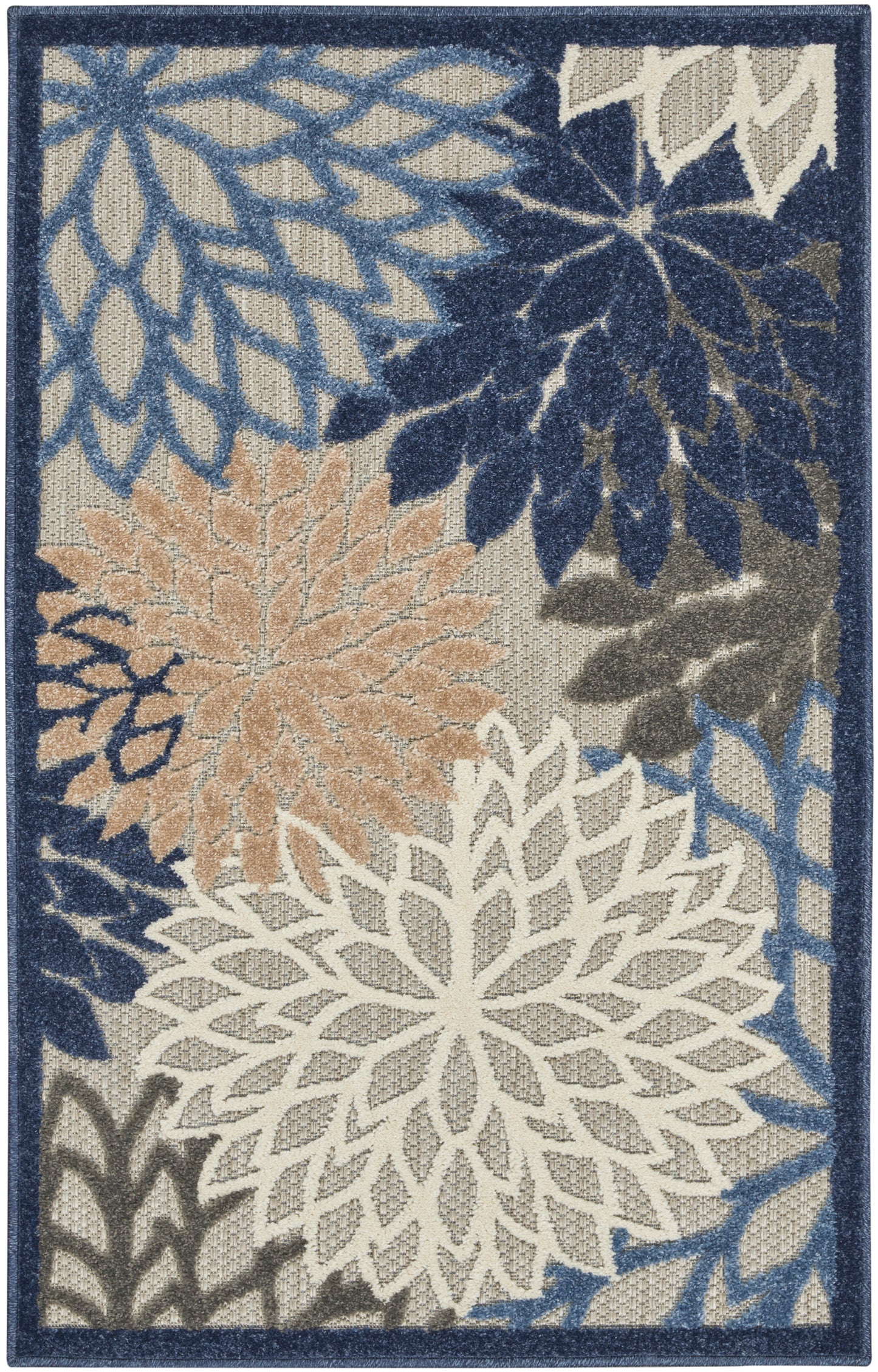 Rectangular area rug with large white, tan and light-blue floral motifs on a blue field and navy border.