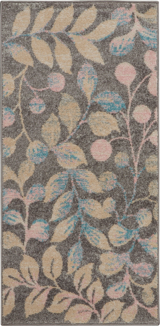 Rectangular plush gray rug with pastel beige leaves and pink and blue accents in a botanical pattern.