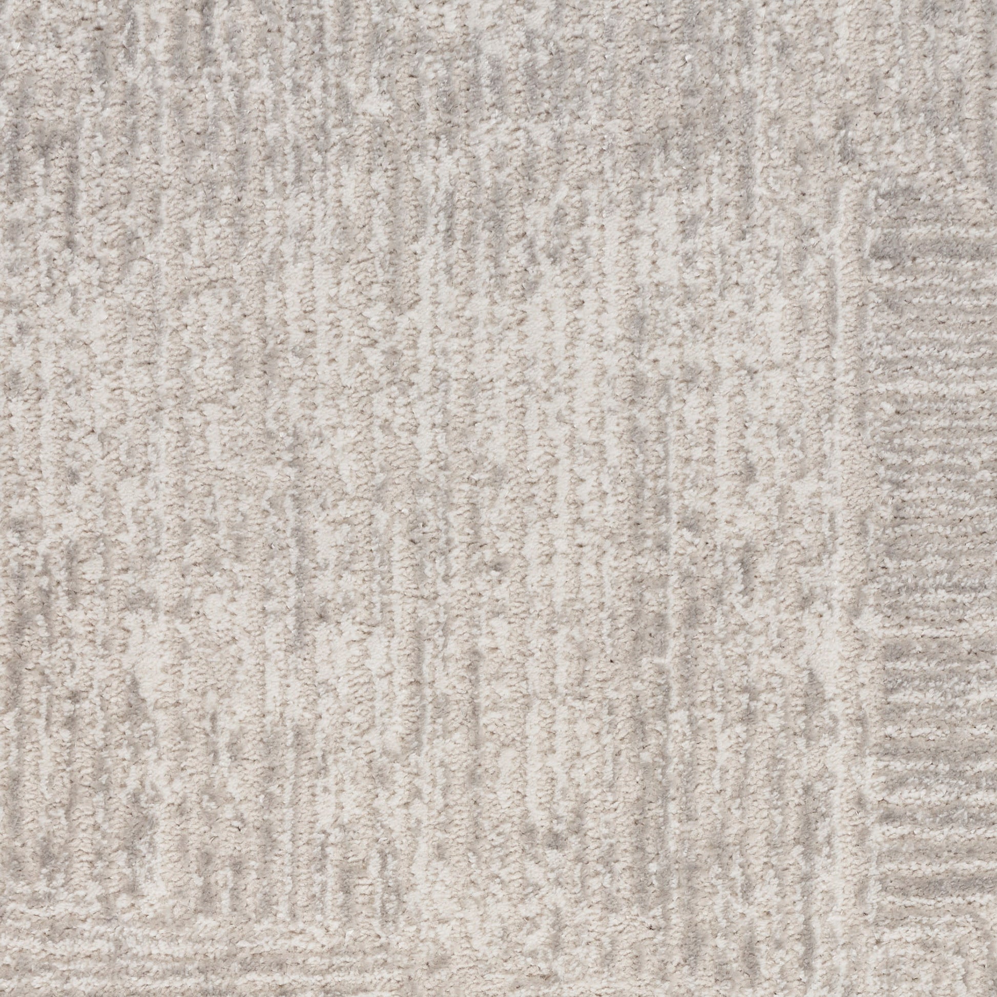 Light grey textured rug with subtle vertical lines and a soft pile.