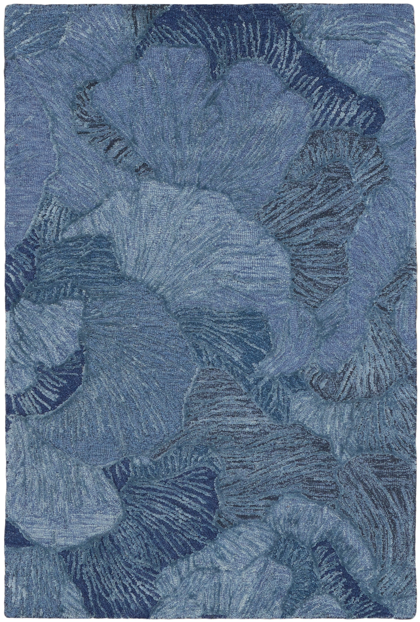 Blue abstract floral rug with overlapping petal shapes in navy and sky tones.