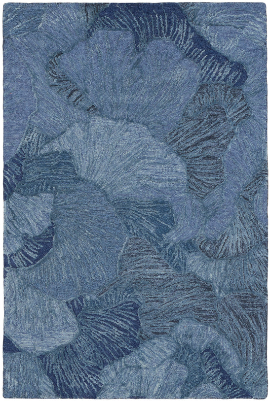 Blue abstract floral rug with overlapping petal shapes in navy and sky tones.