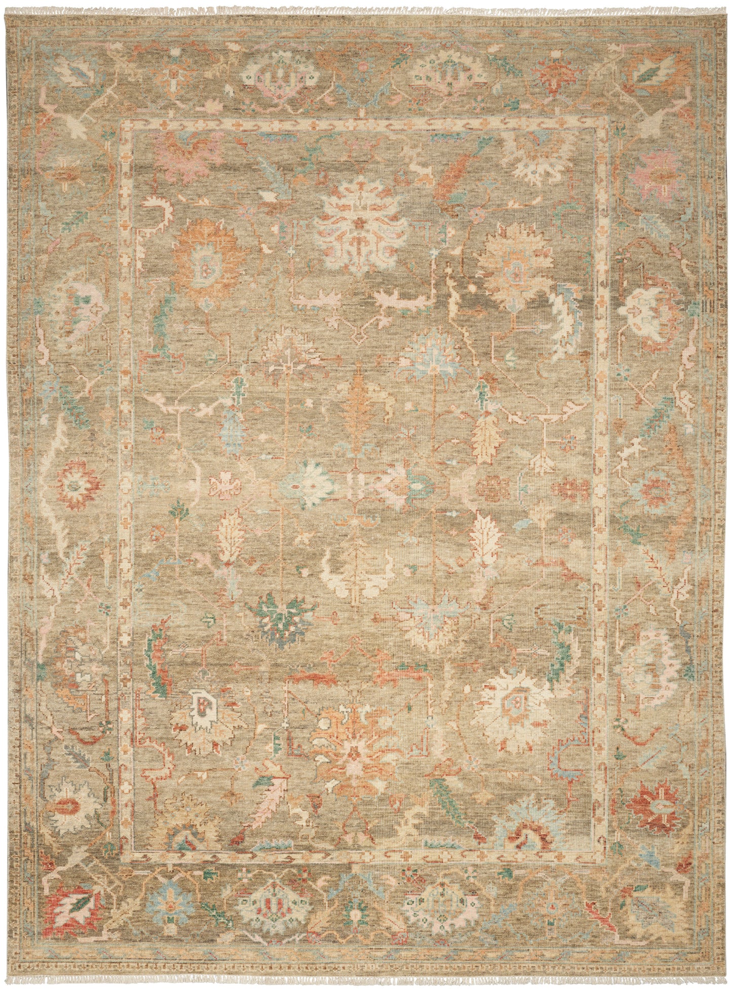 Beige distressed oriental rug with muted floral medallions; ivory, sage and peach with blue, fringed edges.