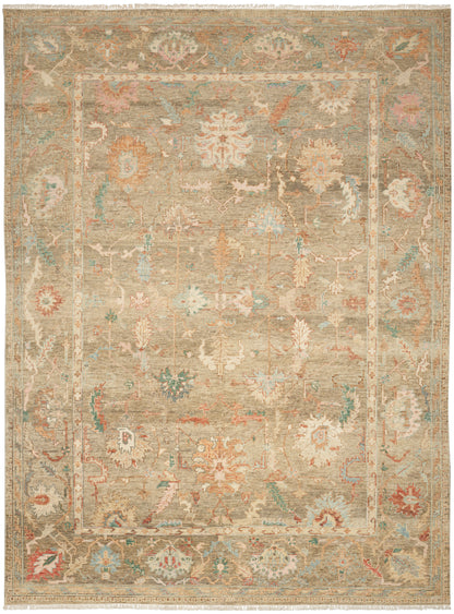 Beige distressed oriental rug with muted floral medallions; ivory, sage and peach with blue, fringed edges.