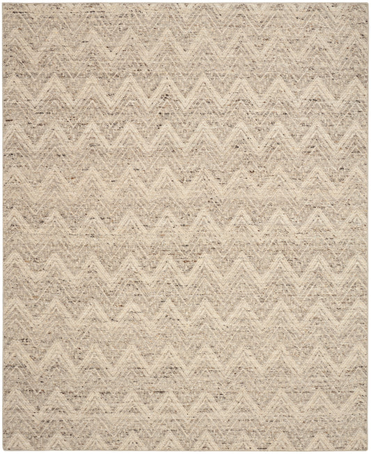 Beige textured rug with a soft chevron zigzag pattern in neutral tones.