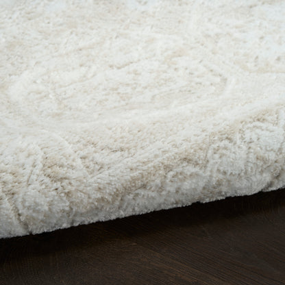 Cream plush shag rug with thick fluffy pile on dark wooden floor.