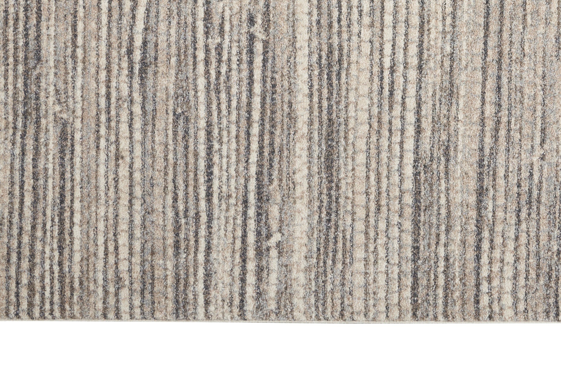 Beige, taupe and gray striped textured area rug close-up with a soft pile.