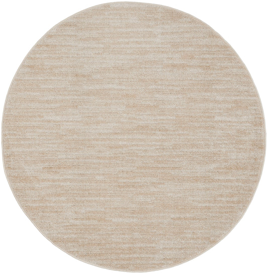 Beige round rug with soft marled texture and neutral cream tones; versatile modern decor accessory.