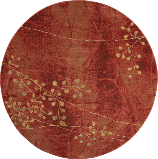 Round red rug with a textured maroon background and gold botanical vine pattern.