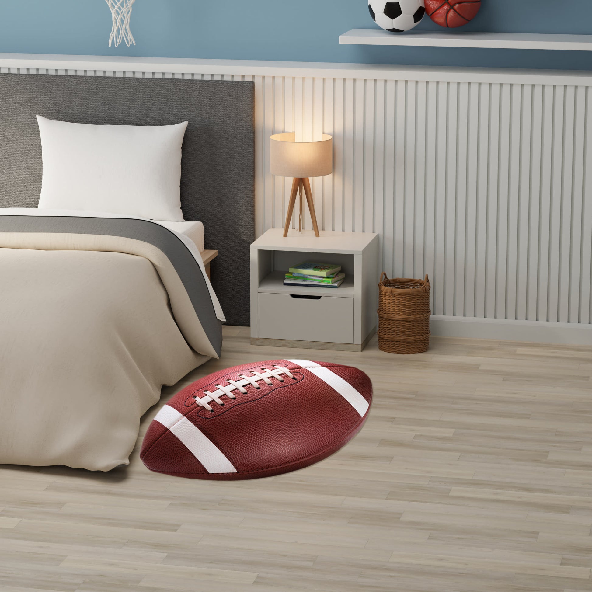 Red football-shaped rug with white laces on light wood floor beside a bed with beige bedding.
