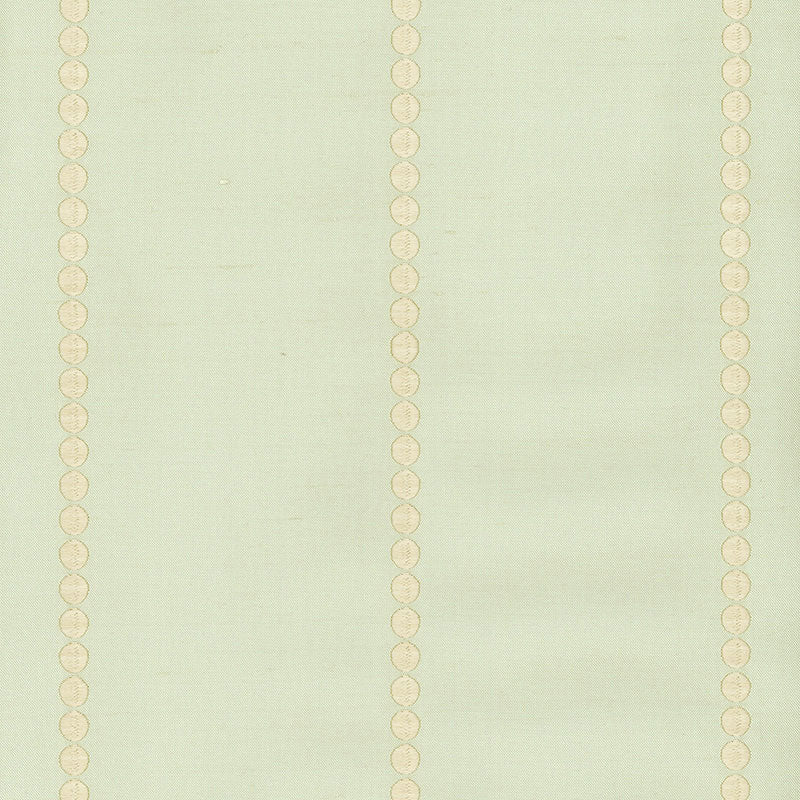 Mint green fabric with vertical cream dotted stripes of circular medallions.