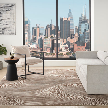 Modern living room with a city skyline window, beige metal-frame armchair, gray sofa, black wood-top side table, swirl rug.