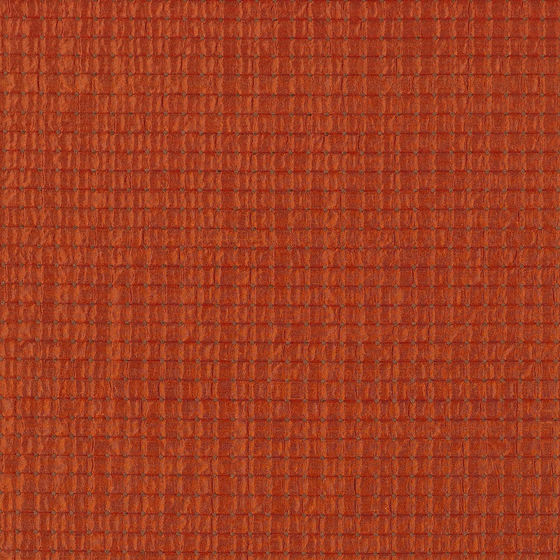 Rust-orange silk weave fabric close-up with a dotted texture.