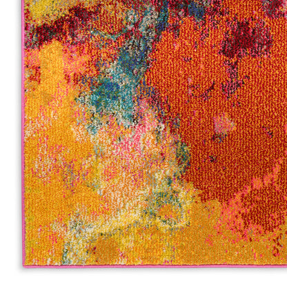 Vibrant abstract area rug with tufted pile in yellow, orange, red, pink, teal and blue hues.