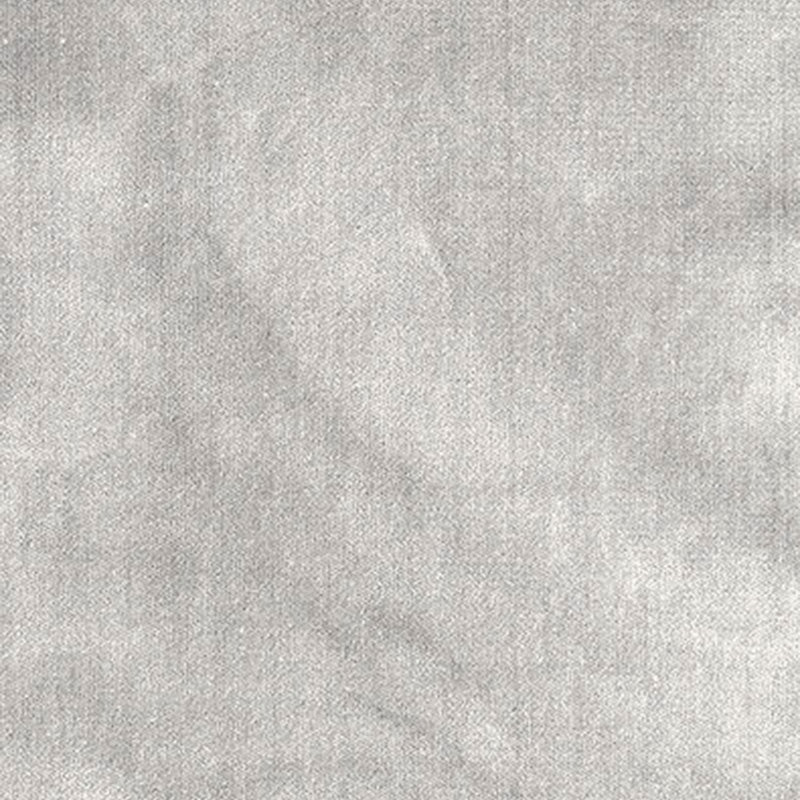 Close-up of light gray textured fabric with a soft, mottled surface.