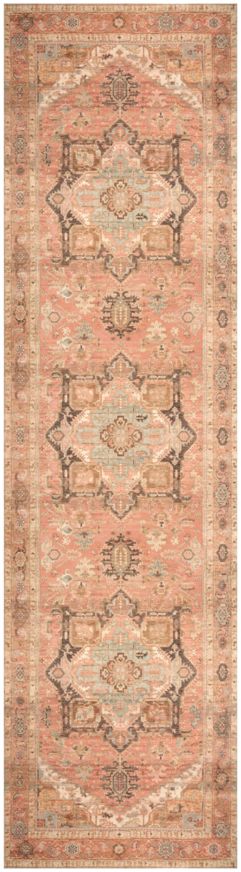 Long narrow Persian-style runner rug in peach with repeating dark gray geometric medallions, ivory accents, and ornate borders.